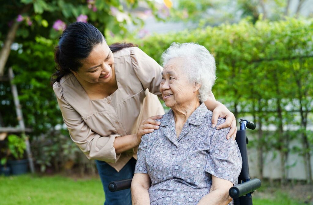 carer and a senior sitting outside